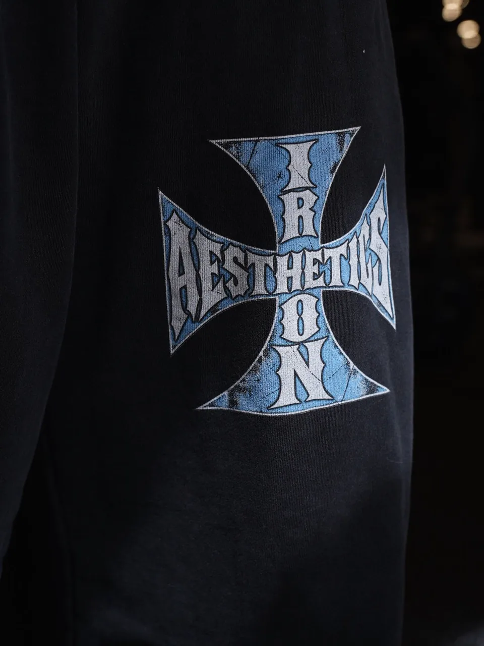 Close up of the cross on the Blue Cross Sweatpants