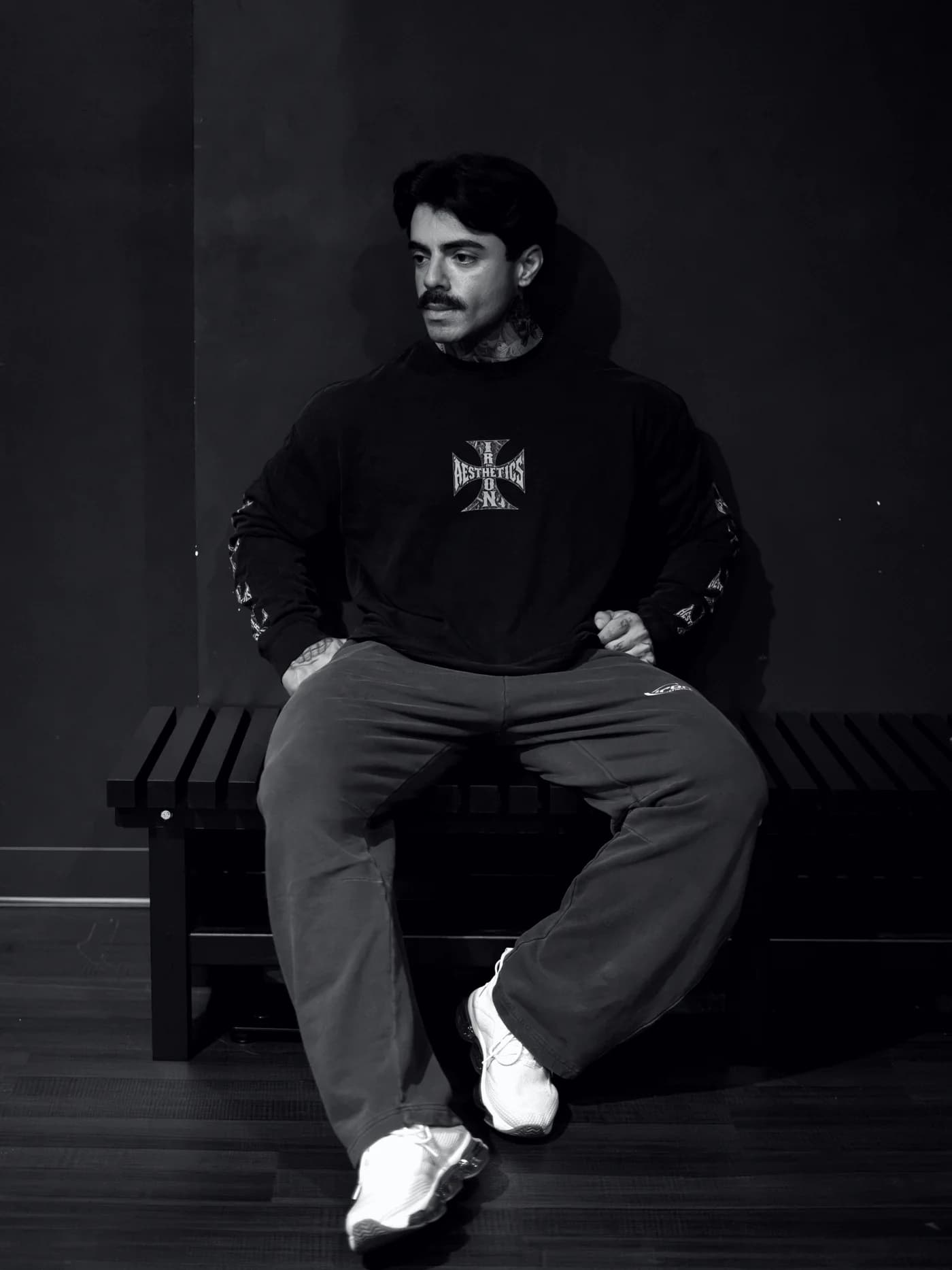 The Vintage Washed Long Sleeve, worn on a gym bench