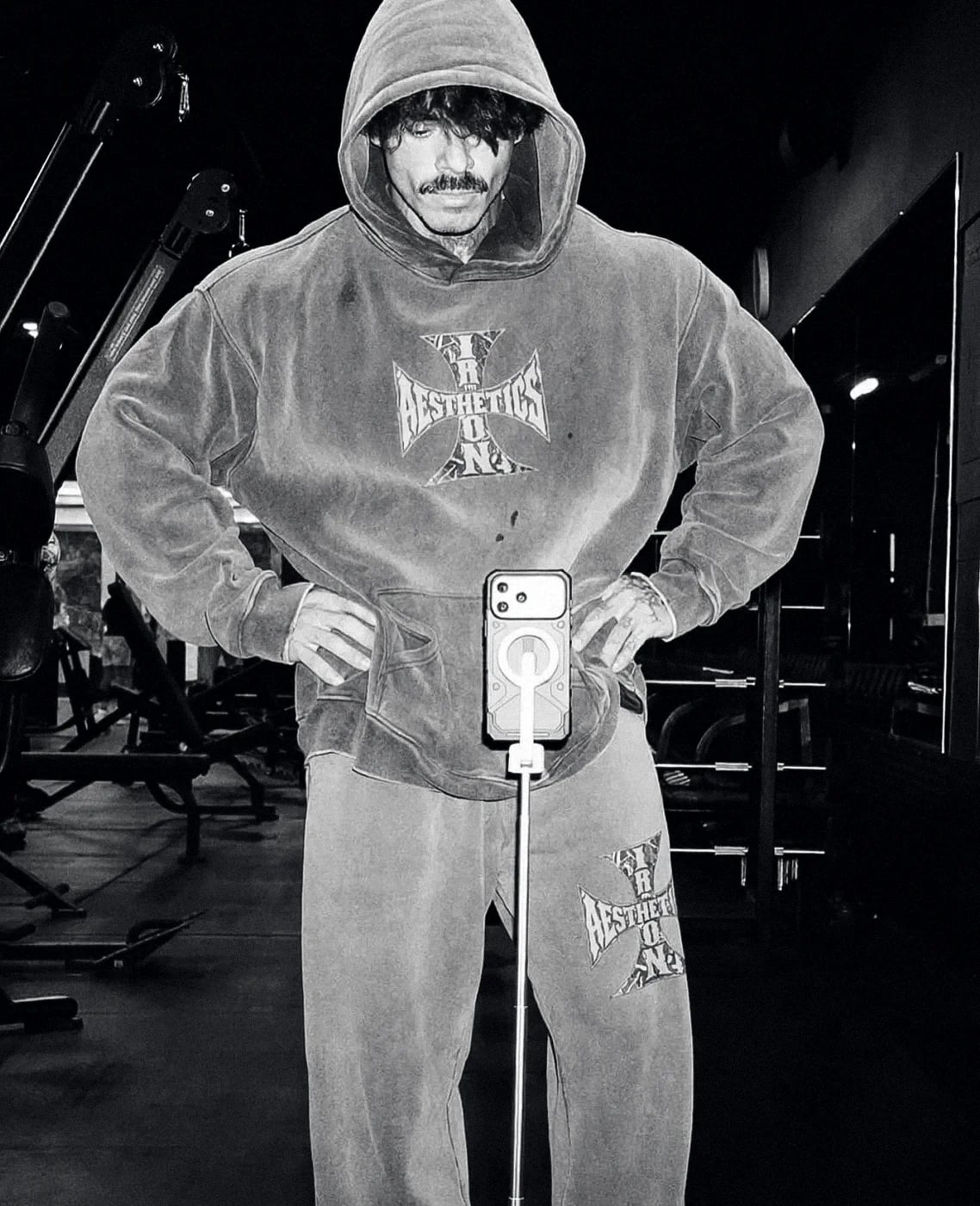 Athlete in the Snow Wash hoodie and sweatpants under gym lights