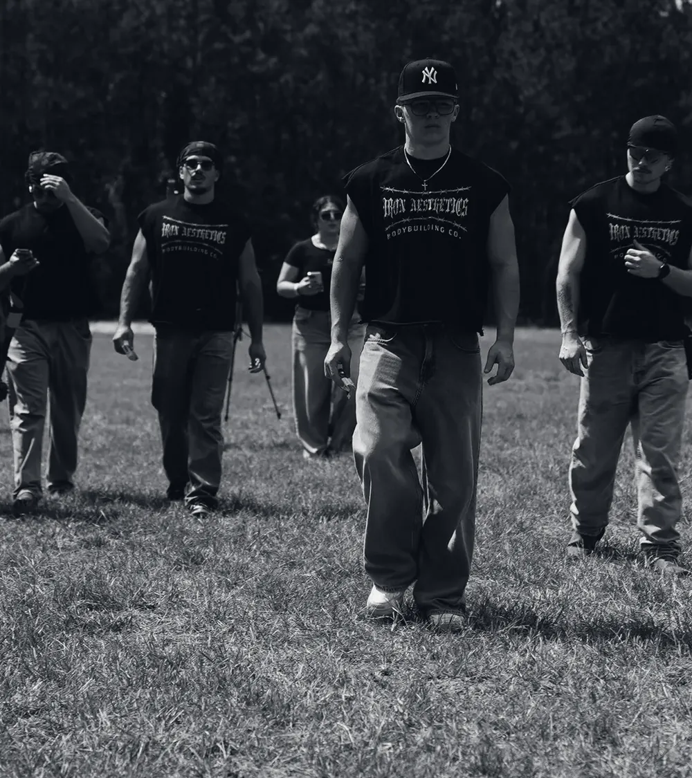Iron Aesthetics athletes walking across a field